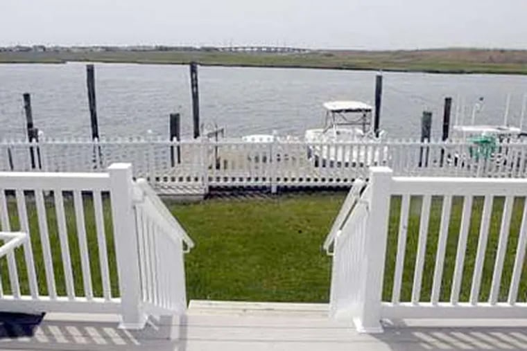 A back deck looks out at the bay at Mike Lorenz's house in Ocean City. A bistro area opens onto both the main living area and the back deck.