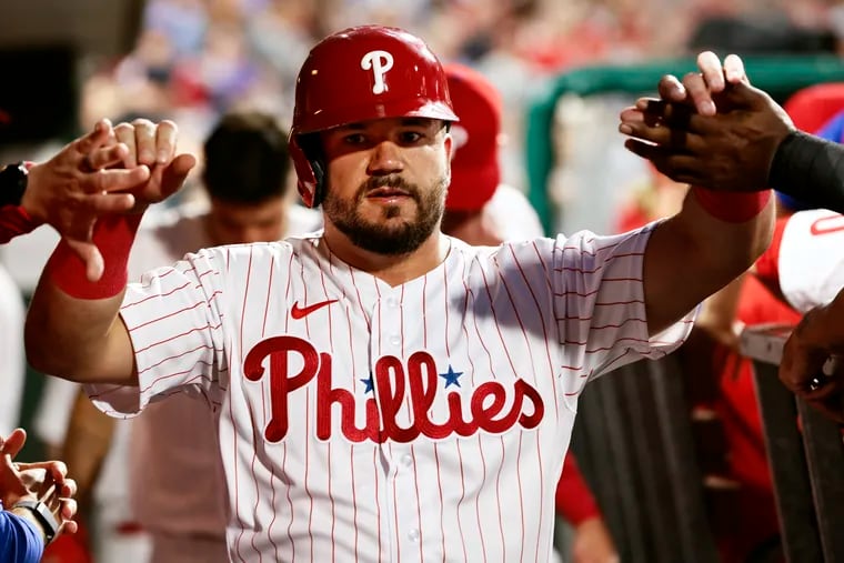 Action Network Use Only - PHILADELPHIA, PA - AUGUST 26: Kyle Schwarber #12 of the Philadelphia Phillies is congratulated after scoring on a single by Rhys Hoskins #17 during the second inning of a game at Citizens Bank Park on August 26, 2022 in Philadelphia, Pennsylvania. (Photo by Rich Schultz/Getty Images)