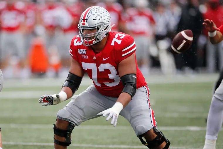 Ohio State offensive lineman Jonah Jackson pass protecting against Wisconsin in October.