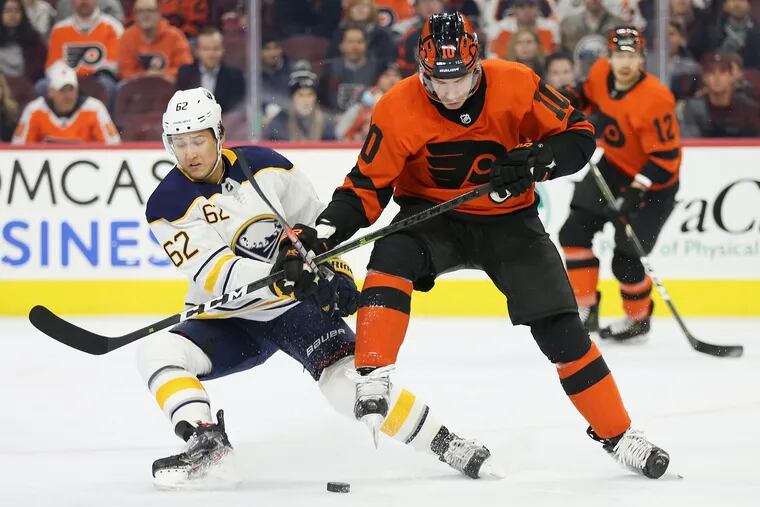 Flyers' Corban Knight (10) and Buffalo Sabres' Brandon Montour (62) compete for the puck during a game at the Wells Fargo Center in South  Philadelphia on Tuesday, Feb. 26, 2019.