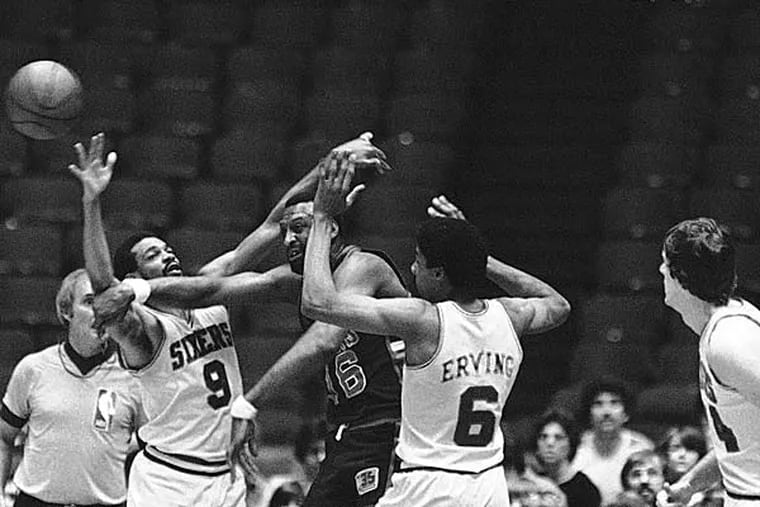 Milwaukee Bucks Bob Lanier has trouble passing off as Sixers Lionel Hollins, left, and Julius Erving (6) close in during final game of NBA Playoff Series on Sunday, April 19, 1981 in Philadelphia. Sixers eliminated the Bucks from the title race by beating Milwaukee, 99-98. (Murray/AP file)