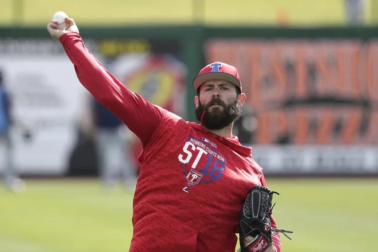 Philadelphia Phillies pitcher Jake Arrieta throws during a work out before a spring baseball exhibition game against the Tampa Bay Rays, Tuesday, March 13, 2018, in Clearwater, Fla.