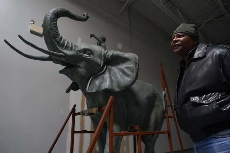 Derrick W. Owings in front of Petal, a sculpture of an elephant that for decades was a favorite of shoppers and their children at the now-demolished Burlington Center Mall. Owings heads up the Arts Guild of New Jersey, which hopes to find Petal a permanent home.