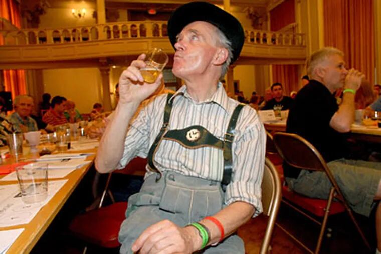 Hardy Von Auenmueller, chairman of the German Society, dressed for the occasion as he attends a beer tasting Saturday. Philadelphia is being called &quot;the best beer-drinking city in America.&quot; (APRIL SAUL / Staff Photographer)