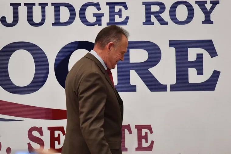 U.S. Senate candidate Roy Moore leaves the stage after speaking at the RSA activity center, Tuesday, Dec. 12, 2017, in Montgomery, Ala. Moore did not concede defeat to his Democratic opponent Doug Jones.