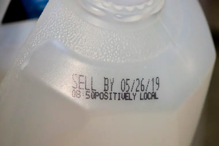 This Friday, May 24, 2019 photo shows the "sell by" date for a jug of milk in New York. In May 2019, U.S. regulators are again urging food makers to reduce the variety of terms like "best by" and "use by" that cause confusion about when food should be thrown out. (AP Photo/Bebeto Matthews)