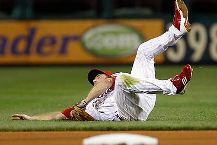 Chase Utley was hit in the head with a pitch in the sixth inning of last night's game. (Yong Kim/Staff Photographer)