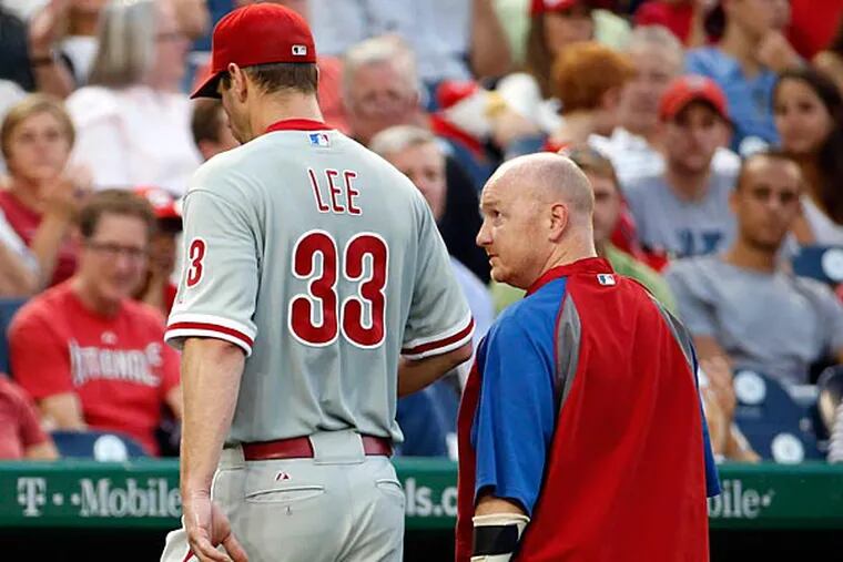 Phillies starting pitcher Cliff Lee (33) walks to the dugout during the third inning of a baseball game against the Washington Nationals at Nationals Park Thursday, July 31, 2014, in Washington. The Phillies announced that Lee had a recurrence of the left flexor pronator strain that sidelined him in May. (Alex Brandon/AP)