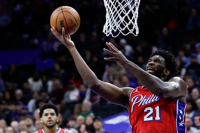 Sixers center Joel Embiid drives to the basket against the Detroit Pistons on Friday on his way to two of his game-high 35 points.