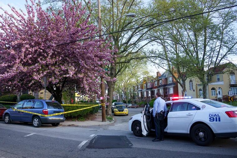 Police stand by in West Oak Lane after the bomb squad removed a potentially explosive device from a residence from which 10 firearms had been reported stolen.