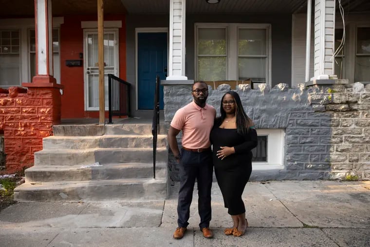 Darnell and Shirda Hudson near their new home in Olney. They bought it through the Pennsylvania Housing Finance Agency's Revitalizing Neighborhoods and Increasing Homeownership pilot program for first-time home buyers.