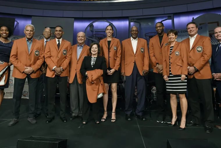 The 2017 class of inductees into the Basketball Hall of Fame, from the left, Lauren Meyers, accepting on behalf of her late great uncle Zack Clayton, Nick Galis, Robert Hughes, Mannie Jackson, Tom Jernstedt, Thelma Krause, accepting on behalf her late husband Jerry Krause, Rebecca Lobo, George McGinnis, Tracy McGrady, Muffet McGraw, Bill Self, and Naismith Hall of Fame President and CEO John Doleva.pose for a group photo at the end of a news conference at the Naismith Memorial Basketball Hall of Fame, Thursday, Sept. 7, 2017, in Springfield, Mass.