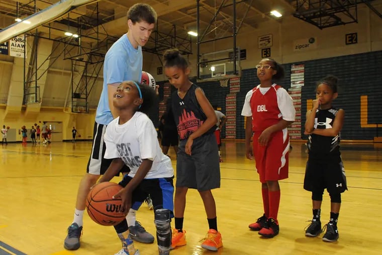 Philadelphia Youth Basketball's summer camp at La Salle University combines on-court basketball instruction with classroom teaching that uses the sport to teach mathematics, business, history, geography, and other subjects.