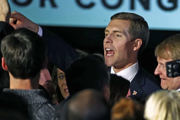 Conor Lamb, the Democratic candidate in Pennsylvania’s 18th Congressional District special election, celebrates with supporters at his election night party in Canonsburg early Wednesday.