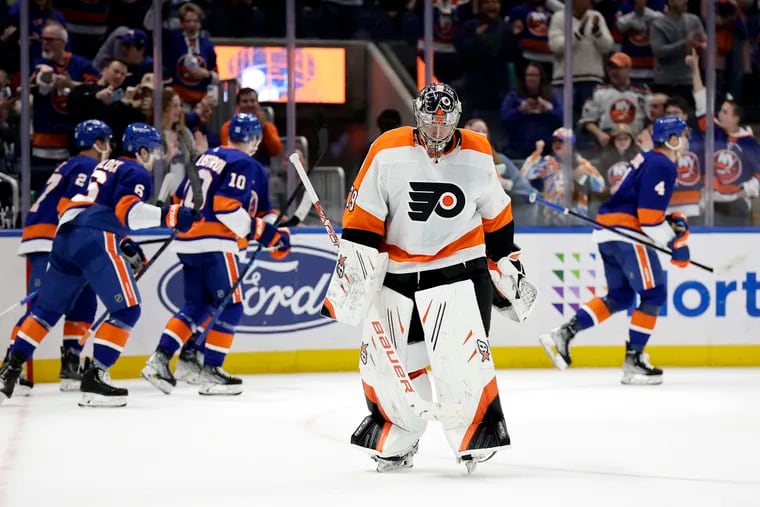 Flyers goaltender Carter Hart reacts after giving up a goal to New York Islanders defenseman Samuel Bolduc (4) in the second period on April 8.