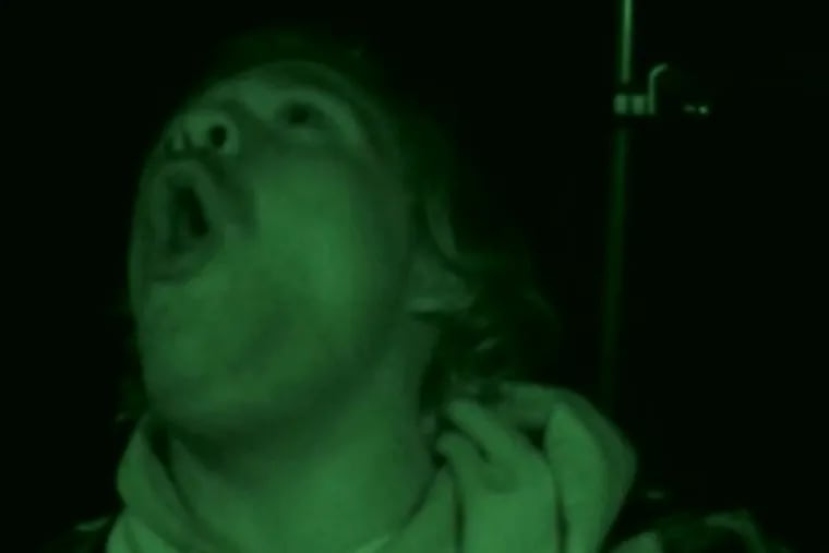 Kyle Newhall of Pemberton, Burlington County, howls to stir up Bigfoots during a late-night search in woods near Medford on a "Finding Bigfoot" episode that premiered on Animal Planet on Jan. 26, 2014.