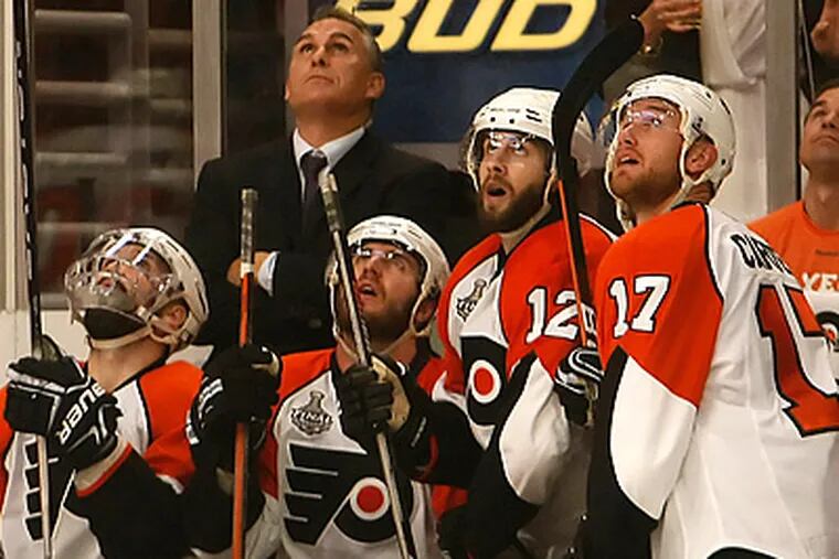 The Flyers' bench watch the replay of the what would be the Blackhawks' game winning goal. (Ron Cortes / Staff Photographer)