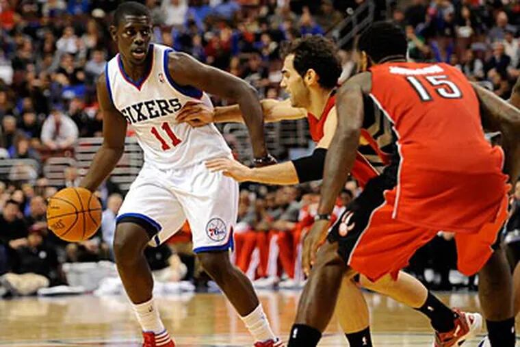 Sixers point guard Jrue Holiday finished with 14 points and six assists against the Raptors. (Michael Perez/AP)