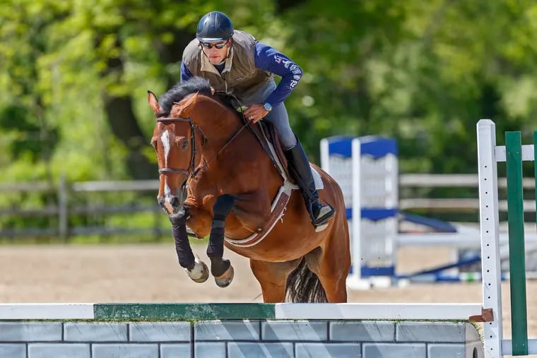 David Wilbur, a rider who will be showing at the Devon Horse Show, works Shakira, a hunter owned by Ellen Greiner, over a jump in preparation for competing in the Devon Horse show later this month, at Redfield Farm in Califon, N.J., on May 16, 2019. Greiner will be riding Shakira at Devon.