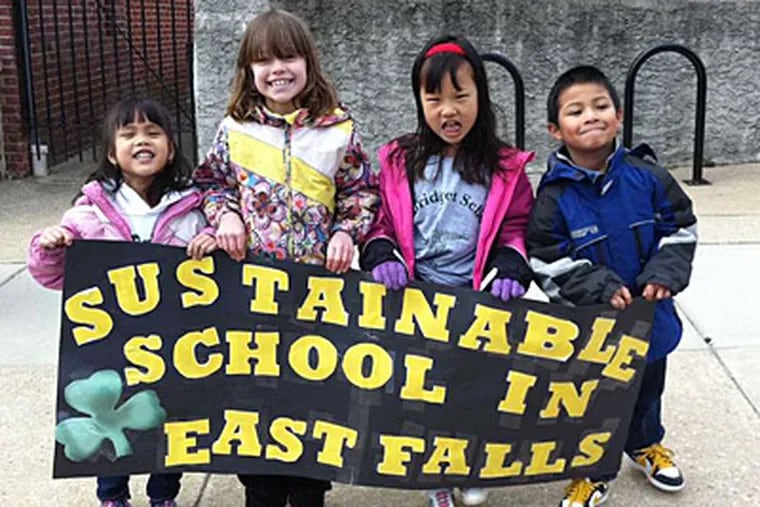 Students at St. Bridget's join their families for a rally Saturday to save their East Falls school, which is scheduled to merge with Holy Child in Manayunk.