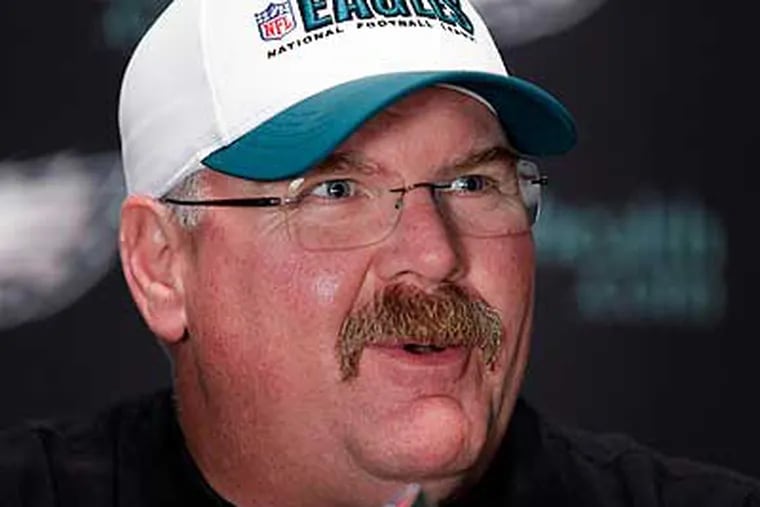Andy Reid's players have remained loyal to him in spite of their feelings towards the front office. (Alex Brandon/AP)