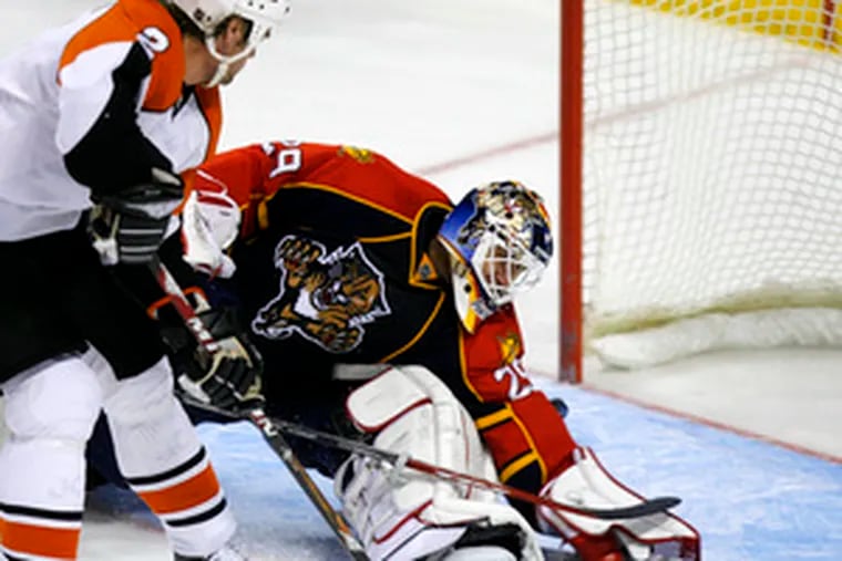 Derian Hatcher slips the puck past Panthers goalie Tomas Vokoun for the only score of the game.