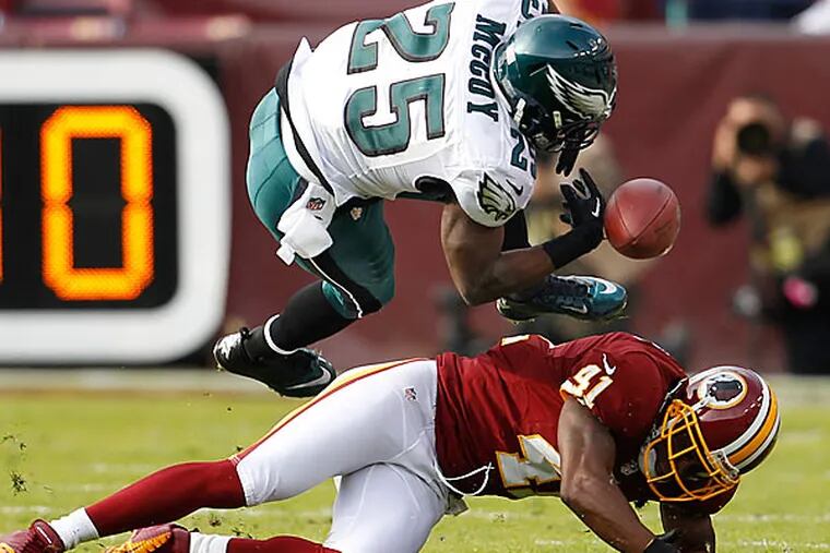 Eagles running back LeSean McCoy is upended by Redskins linebacker Madieu Williams in the first quarter. (Ron Cortes/Staff Photographer)