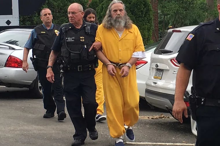 Lee Kaplan, front in yellow, and Daniel Stoltzfus, back in yellow, are led to a preliminary hearing Tuesday, Aug. 2, 2016, outside Bucks County Magisterial District Judge John I. Waltman’s courtroom in Feasterville, Pa.