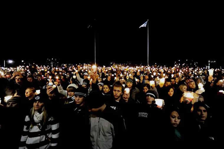 Thousands of students, community members, and Penn State fans filled the Old Main lawn on Nov. 11, 2011 for a vigil held to show support for the victims of the Sandusky sexual abuse scandal. 