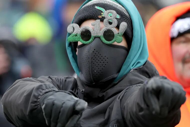 A fan wears a pair of 2018 glasses as the Philadelphia Eagles play the Dallas Cowboys in Philadelphia, PA on December 31, 2017. DAVID MAIALETTI / Staff Photographer