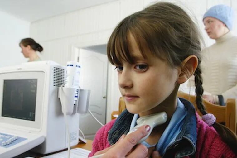 A seven-year-old has her thyroid tested for abnormalities in 2006 in the Ukraine. A test that University of Pennsylvania specialists helped to validate, promises more accurate assessment of whether thyroid nodules are cancerous.  (AP Photo/Efrem Lukatsky)