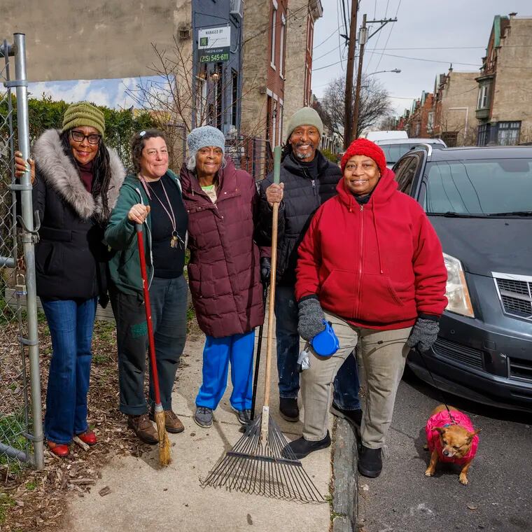 Members of the Viola Street Garden, 4200 block of Viola Street in Philadelphia on Thursday. From left they are Joyce Smith, Mandy Katz, Naomi Smith, (founder and gardener) Randy Smith and Paulette Fields with Tess.