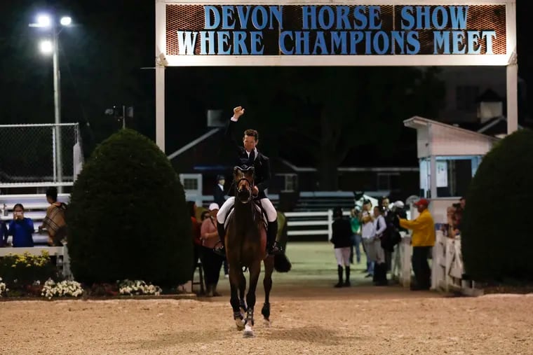 McLain Ward pumps his fist with HH Azur after winning the jump-off in the Sapphire Grand Prix of Devon at the Devon Horse Show and County Fair in Devon, Pa on Thursday, May 30, 2019.