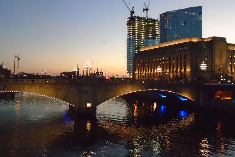 The Schuylkill at dusk, with the FMC Tower rising in the background, adding 49 stories to the cityscape.