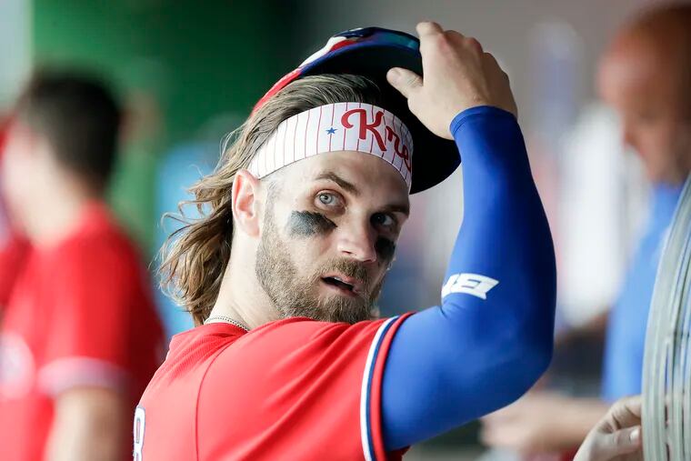 Phillies right fielder Bryce Harper in the dugout during a spring-training game Tuesday.