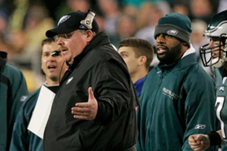 Injured quarterback Donovan McNabb (right) was on the sideline with Eagles coach Andy Reid during a Giants game in January.