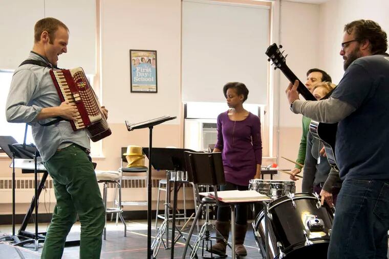 Music director/composer/cast member Alex Bechtel of &quot;This Is the Week That Is&quot; plays accordion as he rehearses the 1812 Productions troupe (from left) Aime Donna Kelly, Dave Jadico, Jennifer Childs, Scott Greer.