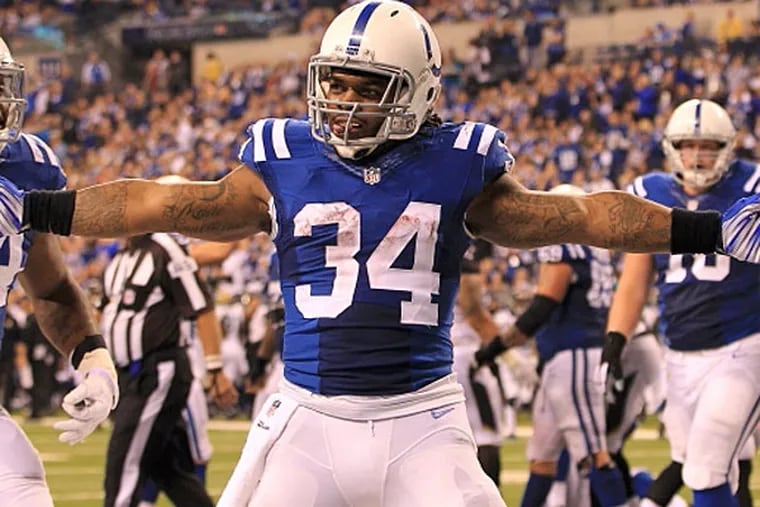 Indianapolis Colts running back Trent Richardson (34), along with Josh Cribs say they will jump into the Dawg Pound if they score on Sunday. (Pat Lovell/USA TODAY Sports)