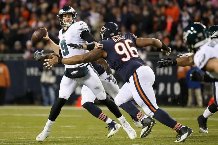 Nick Foles throws under pressure from Bears defensive tackle Akiem Hicks in the second quarter.