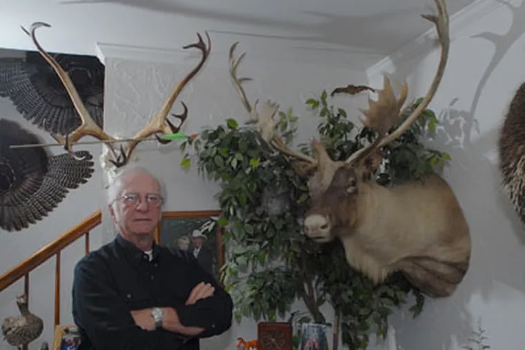 Joe Kleiner, age 69, of Hatfield has been hunting over 50 years. He stands next to a prized Caribou he took with a rifle. (Bob Williams/For The Inquirer)