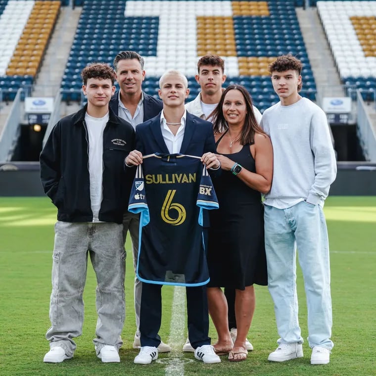 Cavan Sullivan (center) has signed with the Union. From left is his family: Declan, father Brendan, Cavan, Quinn, mother Heike, and Ronan.