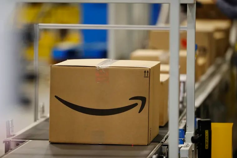 This May 3, 2018, photo shows boxes on a conveyor belt during a tour of the Amazon fulfillment center in Aurora, Colo. The explosion in online shopping has led to porch pirates and stoop surfers swiping holiday packages from unsuspecting residents. The cops in one New Jersey city are trying to catch the thieves with some trickery of their own. (AP Photo/David Zalubowski)