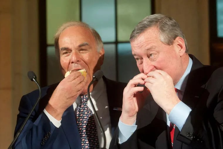 Former Gov. Ed Rendell and Mayor Jim Kenney eat a P.J. Clarke's cheeseburger.