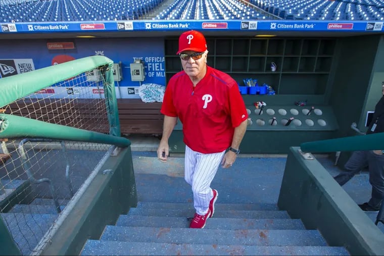 Pete Mackanin heads to batting practice on the day he was fired as manager.