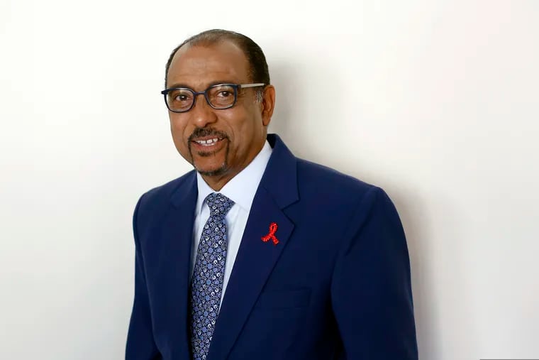 FILE - In this July 18, 2018 file photo embattled UNAIDS chief Michel Sidibe poses for photographers before attending a press conference, in Paris, France. The head of the U.N. agency focusing on AIDS says he’ll leave his post in June, an early departure announced a week after independent experts looking into sexual harassment at UNAIDS blasted its “defective leadership.” (AP Photo/Thibault Camus, file)