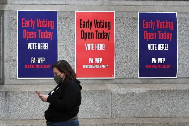 Signs for the Working Families Party hang outside of City Hall in 2020. Party members want to be independent voices when they can win and loyal Democrats when they can’t, writes Kyle Sammin.