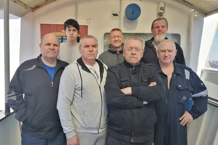 The seven men of the Ocean Force merchant ship have been stuck on the ship since July 2021. First row, from left to right Engineer Vadym Koval, Officer Vitaliy Boyko, Captain Gennadiy Shevchenko, Chief Engineer Vladimir Shykhov. Second row, from left to right, Steward Andriy Tiupa, Chief Officer Viktor Kushmyla, Boatswain Sergiy Kuzhbarenko.