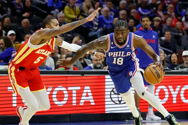 Sixers guard Shake Milton dribbles the basketball past Atlanta Hawks guard Dejounte Murray during the second quarter on Monday.