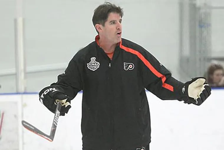 Peter Laviolette did not have one of his trademark outbursts during Game 1 against Boston. (Charles Fox/Staff Photographer)