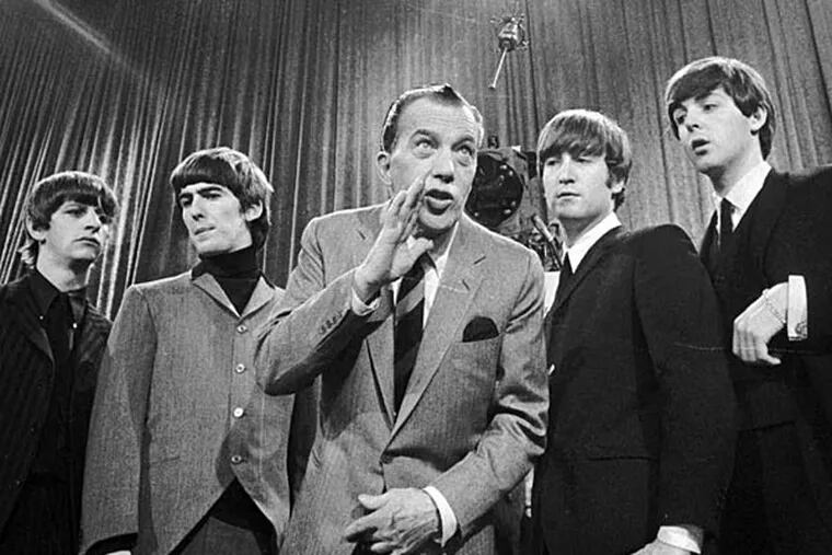 Ed Sullivan with the Beatles before the band's first appearance on his TV show. (from Inquirer Archives)